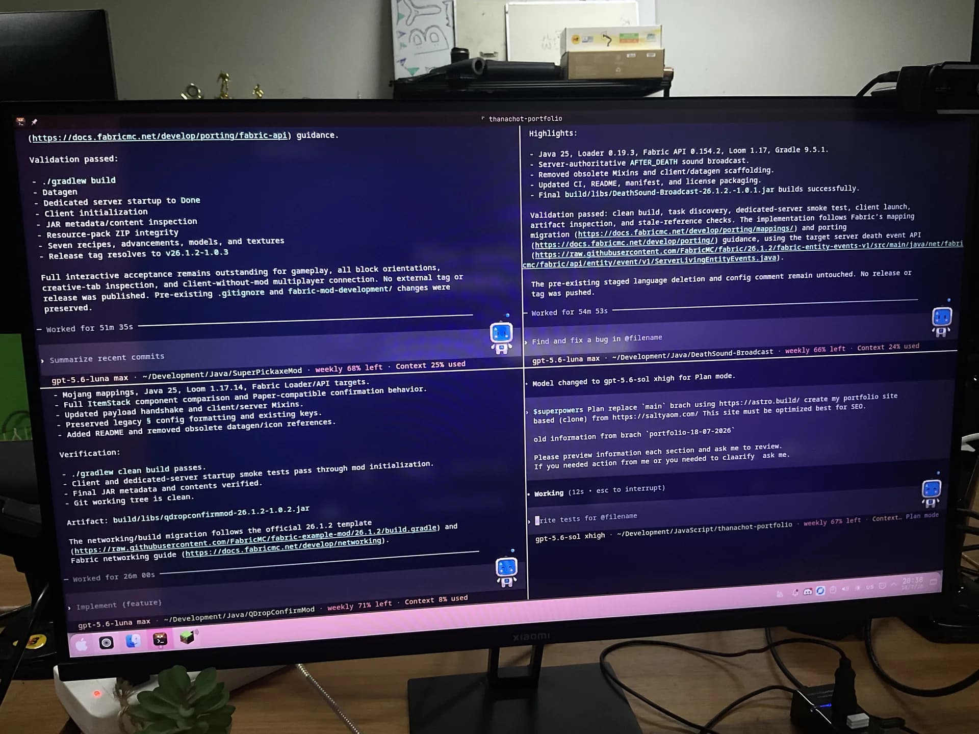 A widescreen monitor showing four terminal sessions for Fabric mod development